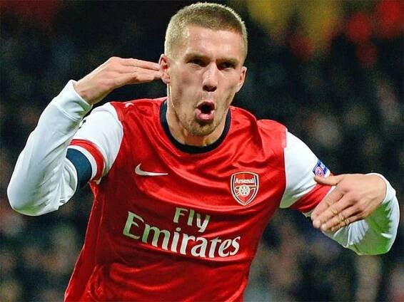 Lukas Podolski celebrates scoring Arsenal's second