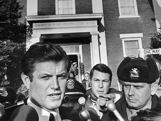Senator Edward Kennedy speaking to reporters outside a courthouse.