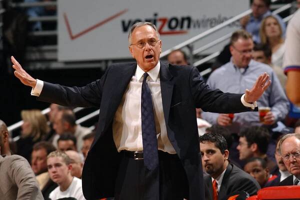 Head coach Larry Brown of the Detroit Pistons argues a call with referee Tony Brothers #25 during a game against the Chicago Bulls on February 25, 2004 at the United Center in Chicago, Illinois. The Pistons defeated the Bulls 107-88. 