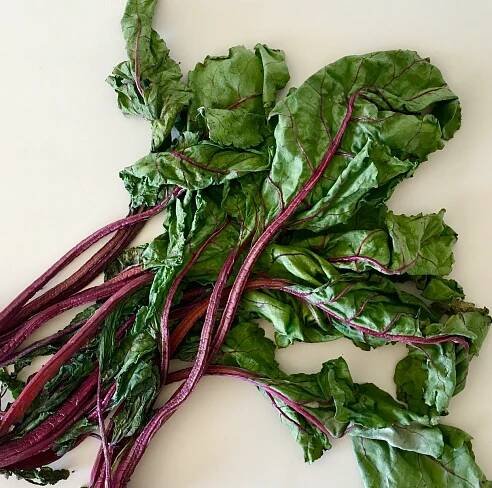 Wilted beetroot leaves and goats cheese tart