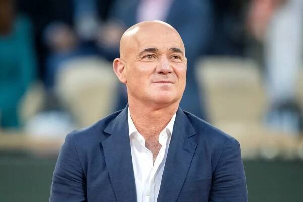 Andre Agassi looks on