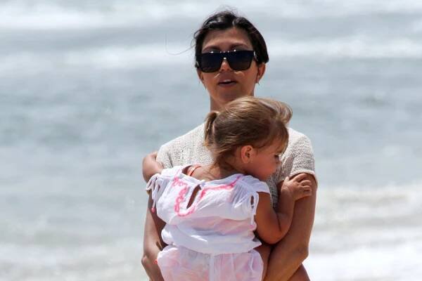 June 18, 2014: The Kardashian crew are seen filming, Kourtney and Khloe Take The Hamptons, on the beach today in The Hamptons, New York today. Pictured here: Kourtney Kardashian, Penelope Disick. Mandatory Credit: Matt Agudo/INFphoto.com Ref: infusny-251|sp|