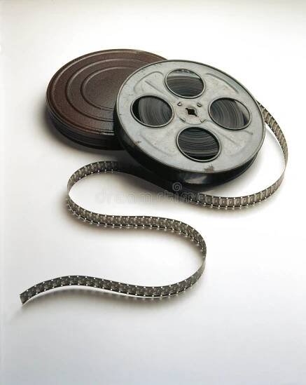 A movie film reel and can with film spooling of the reels. Movie stock images, royalty-free photos and pictures