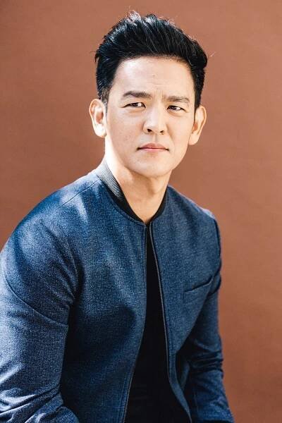 Image may contain Human Person Clothing Apparel John Cho Sleeve Man Sweater Long Sleeve and Sweatshirt
