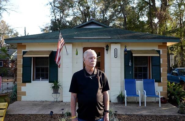Former judge Terry Carter stands in front of his 'man cottage' on Tuesday, Feb. 14, 2017, in the 1500th block of Greene Street in Beaufort.  