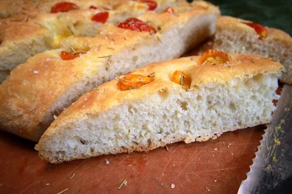 Three Slices of Rosemary Tomato Focaccia Bread on Cutting Board