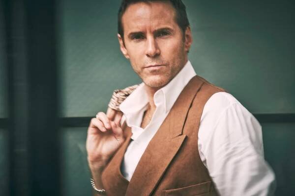 Vest, shirt and jacket by GIORGIO ARMANI;sunglasses by JACQUES MARIE MAGE.