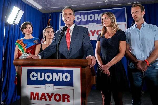 Andrew Cuomo, New York City mayoral candidate, center, speaks during an election night event in New York