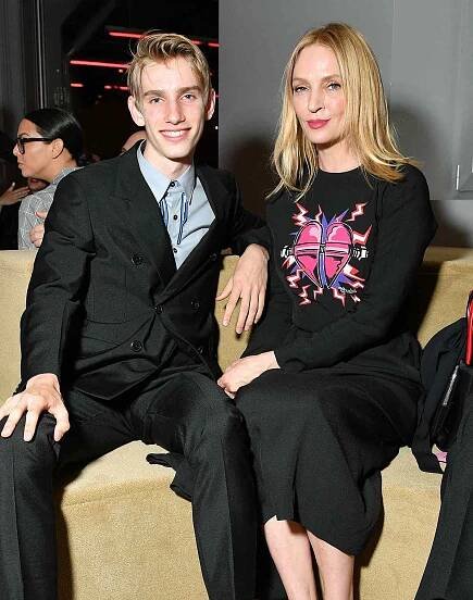 Levon Roan Thurman-Hawke and Uma Thurman attend the Prada Resort 2020 fashion show at Prada Headquarters on May 02, 2019