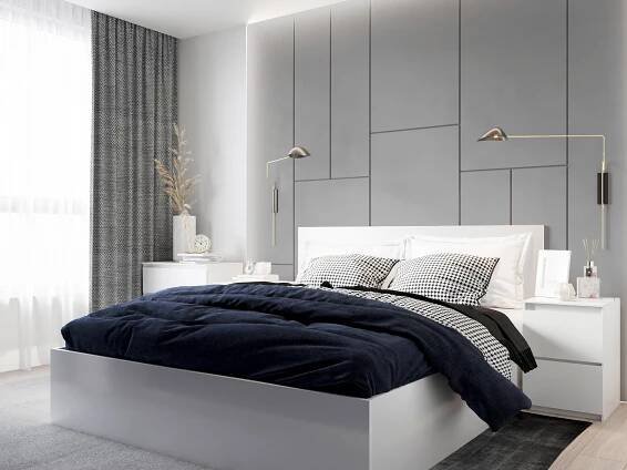 A white stylized bed heading wall is a focal point in this simple bedroom.