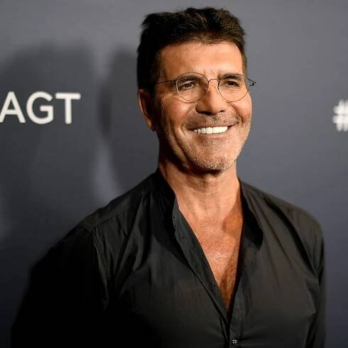 Simon Cowell 'doing spectacularly well' after breaking back, Howie Mandel says