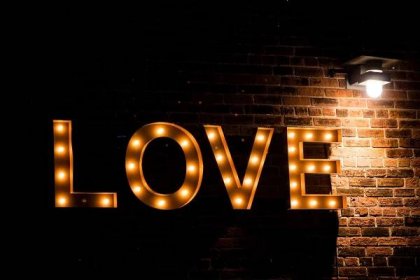 love lightbulb sign on wall