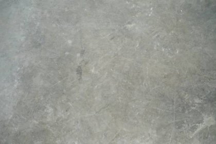 a close up view of a gray marble floor