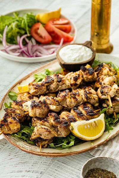 Chicken Souvlaki is packed with a tangy flavor from garlic and lemon marinade. Serve skewers with a creamy 6-ingredient Tzatziki Sauce.