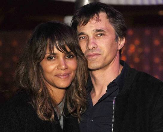 Halle Berry (L) and Olivier Martinez attend the Treats! Magazine Pre-Oscar Party