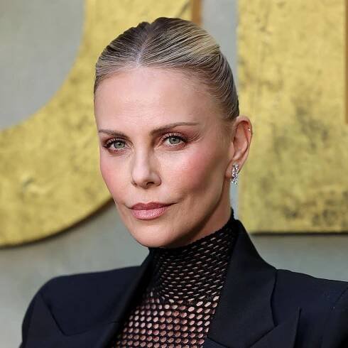 Charlize Theron proves a half-moon manicure is perfect for short nails