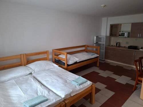 Postel nebo postele na pokoji v ubytování Parťákova Hasičárna & Penzion