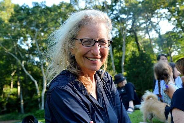 Outdoor photo of Annie Leibovitz at a concert in the Hamptons.
