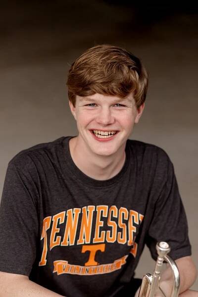 Head shot of high school senior wearing UT Knoxville T-shirt for senior pictures with MegMc Photography