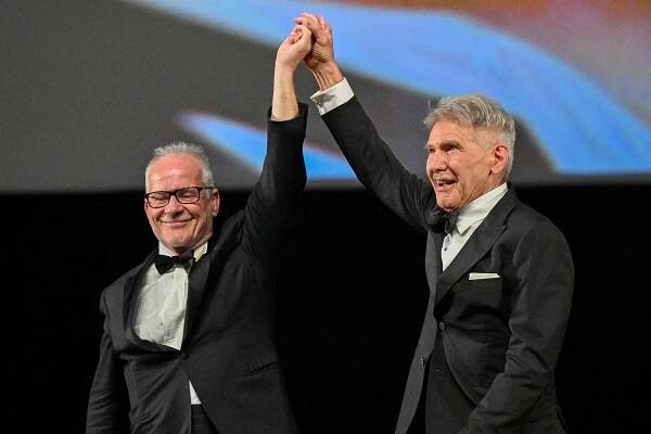Thierry Frémaux with Harrison Ford who receives an honorary Palme D'Or during the 76th annual Cannes film festival