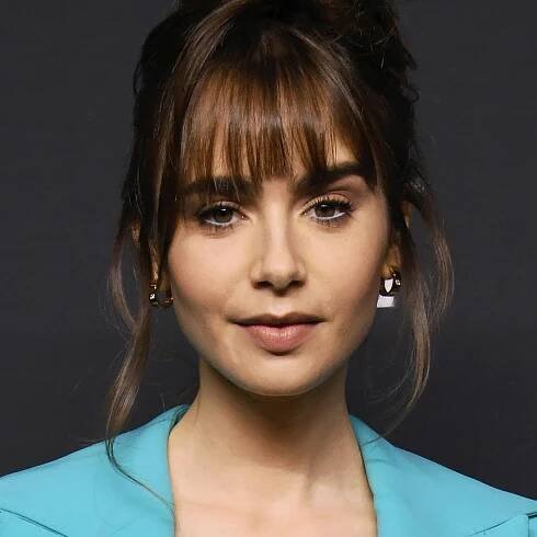 Lily Collins's Hair Must Be Full of Secrets Cause It's Effing Huge