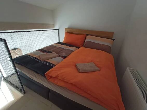 Postel nebo postele na pokoji v ubytování Swiss House Apartments
