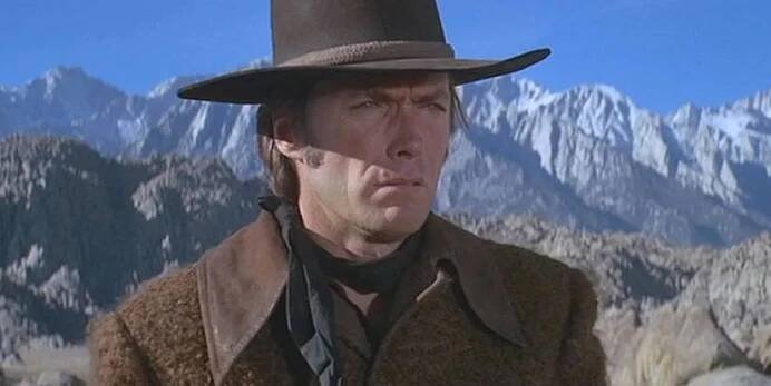 Clint Eastwood as Joe Kidd standing in the mountains in Joe Kidd