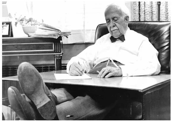 Picture of J. C. Penney at his desk.