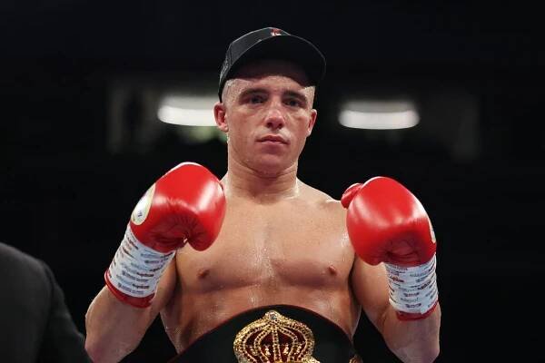Nick Ball celebrates victory over TJ Doheny with his WBA featherweight title