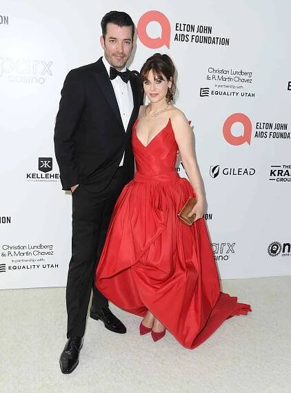 Jonathan Scott, Zooey Deschanel arrives at the Elton John AIDS Foundation's 30th Annual Academy Awards Viewing Party on March 27, 2022 in West Hollywood, California.