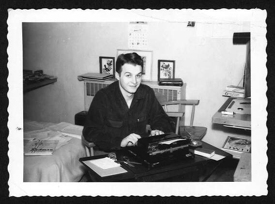 A young George Schneeman working at his typewriter.