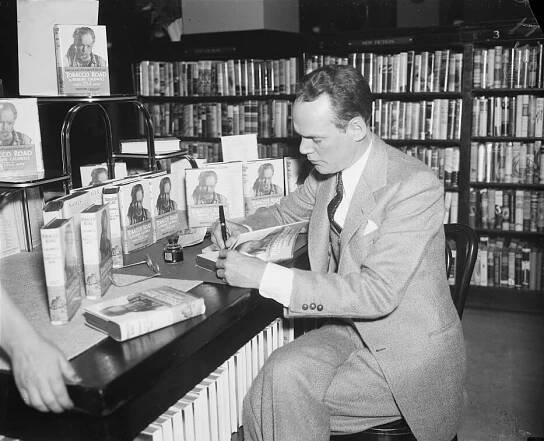 Erskine Caldwell signing copies of Tobacco Road, ca. April, 1936. Photograph by George Harris and Martha Ewing. Courtesy of the Library of Congress Prints and Photographs Division, loc.gov/resource/hec.40683.