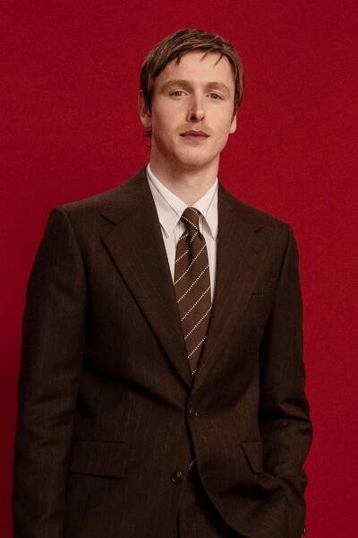Harris Dickinson is dressing like the coolest guy in the office circa 1973