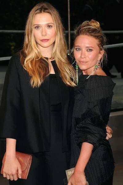 Elizabeth Olsen (L) and designer Mary-Kate Olsen attend 2013 CFDA FASHION AWARDS underwritten by Swarovski at Lincoln Center on June 3, 2013 in New York City.