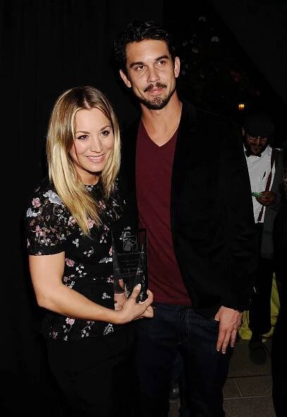 Kaley Cuoco in a floral top with Ryan Sweeting in a burgundy tee and black cardigan