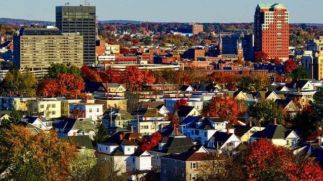 Houses and red trees throughout Manchester, New Hampshire