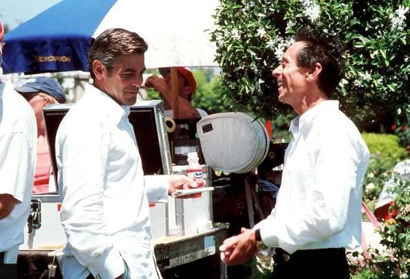 INTOLERABLE CRUELTY, George Clooney, Producer Brian Grazer, on set, 2003, (c) Universal