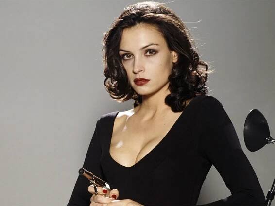 Famke Janssen holding a gun