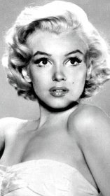 an old black and white photo of a woman in a strapless dress with short hair