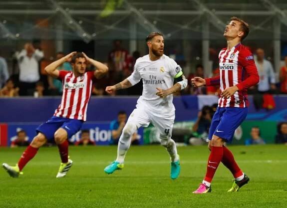 Antoine Griezmann of Atletico Madrid reacts after missing a penalty
