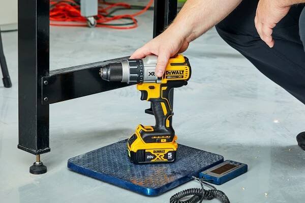Person touching DEWALT XR DCD996P2 20-Volt Hammer Drill
