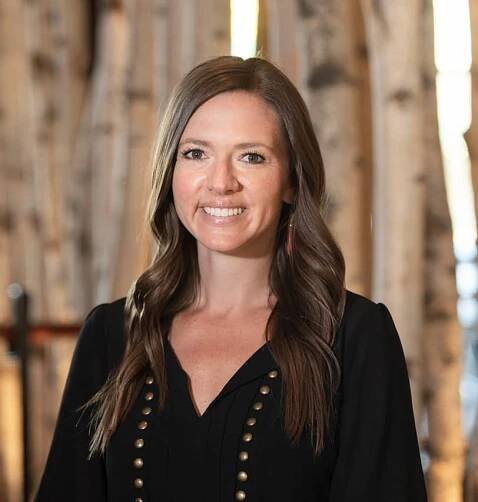 Portrait of Fine Dining Restaurant Group Controller, Megan Hopkins, in the dining room of The Bistro restaurant in Jackson, Wyoming.