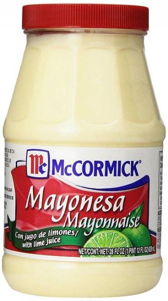 mayonnaise in a glass jar on a white background