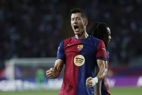 Barcelonas Robert Lewandowski celebrates after scoring