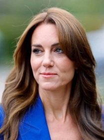 Kate Middleton wearing a blue blazer and a fresh, radiant makeup look