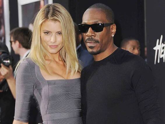 Eddie Murphy and Paige Butcher arrive at the Los Angeles Premiere "Hercules" on July 23, 2014 in Hollywood, California.