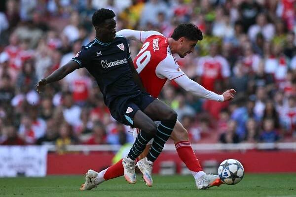 Arsenal's German midfielder #29 Kai Havertz scores scores past Athletic Bilbao's Spanish defender #32 Adama Boiro during the pre-season friendly football match between Arsenal and Athletic Bilbao at the Emirates Stadium in London on August 9, 2025. (Photo by Glyn KIRK / AFP) (Photo by GLYN KIRK/AFP via Getty Images)