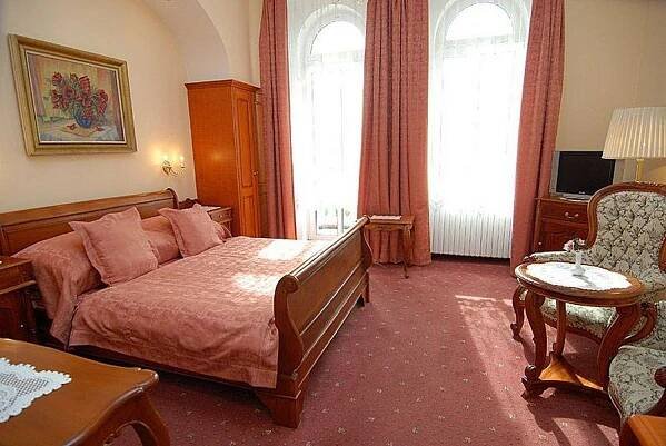 Postel nebo postele na pokoji v ubytování Hotel Opera