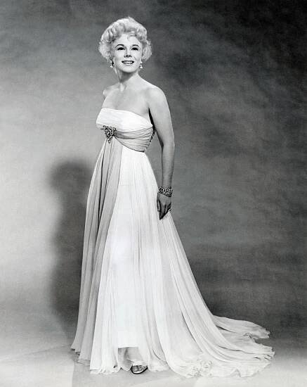 Eva Gabor As A Correspondent In Mgm'S 'Don'T Go Near The Water', In A French Blue Chiffon Dress.