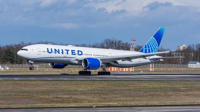 United Airlines Boeing 777 landing shutterstock_2462235207